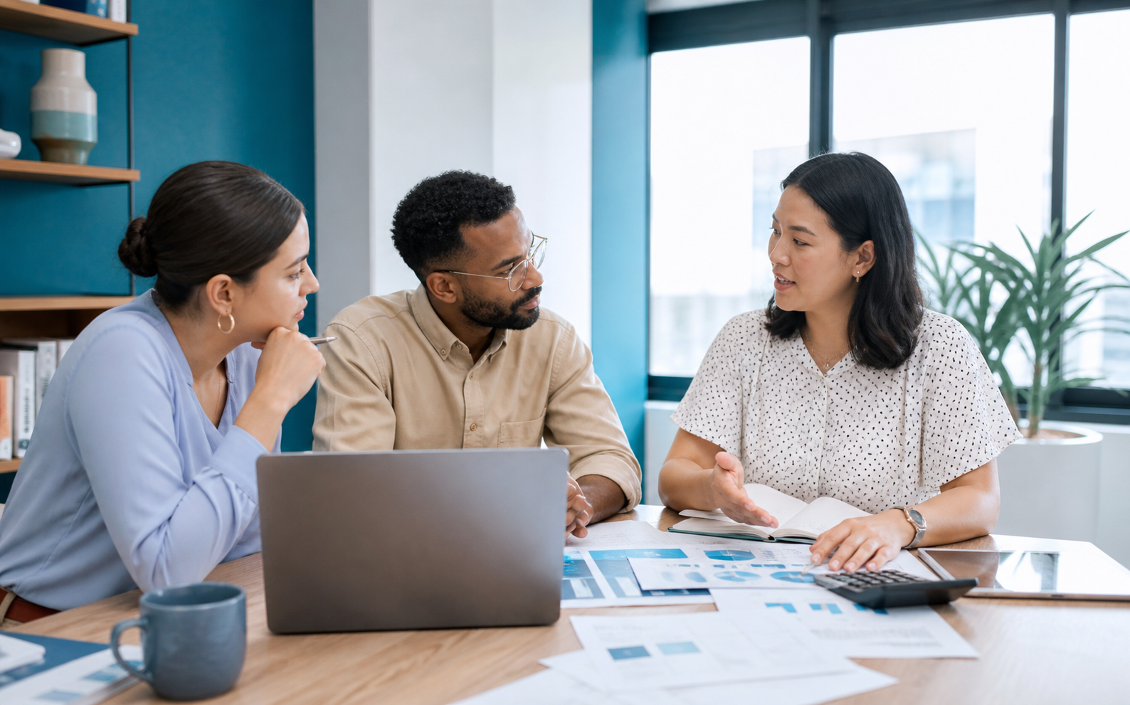 People collaborating on an employee referral program